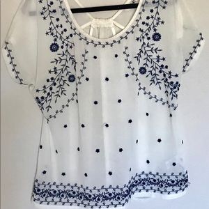 Ivory top with navy blue embroidery